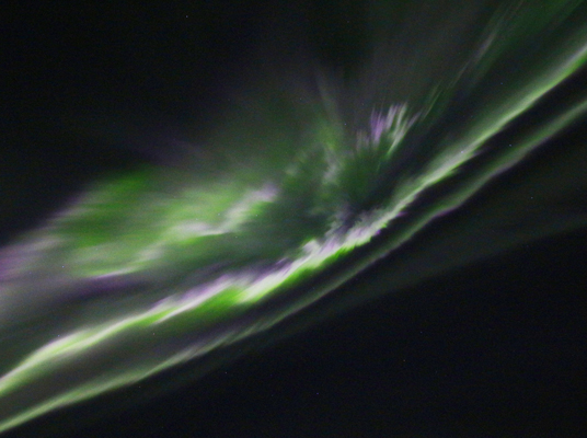 When viewed from directly underneath, the rays of a curtain aurora appear to pour out of the zenith, creating a corona aurora. (Photo by Paul Deans/TQ)