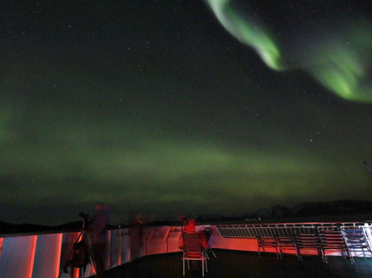 As we sail the coast of northern Norway, we often have to look south to see the northern lights. (Photo by Paul Deans/TQ)